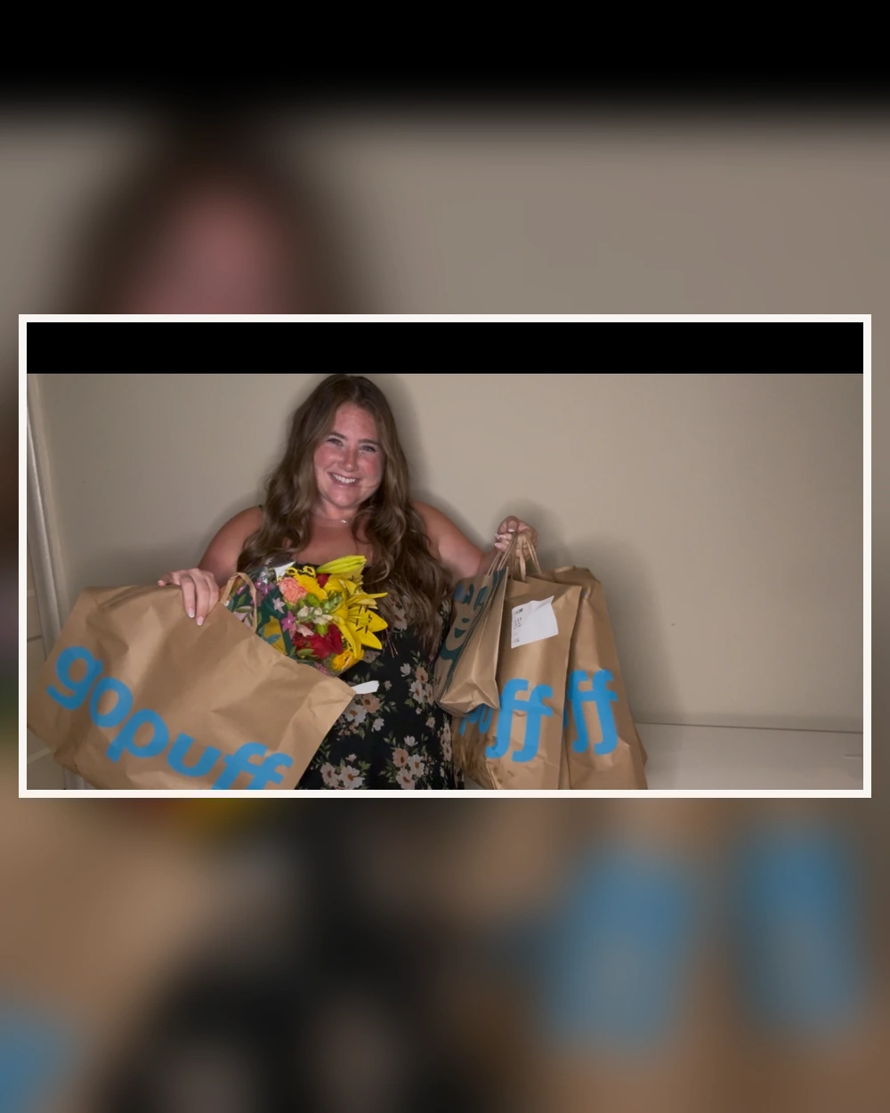 Taylor holding branded delivery bags and flowers
