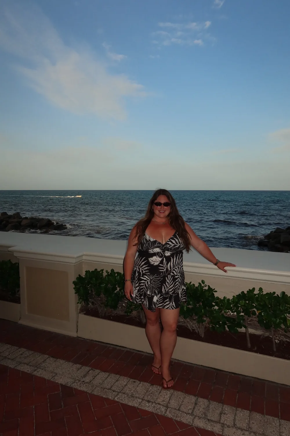 Taylor standing by the ocean